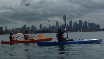 Kayaks, the Sydney skyline, and a landing sea-plane!