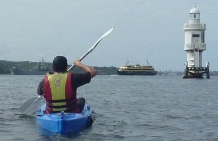 A paddler, a Sydney Ferry, a lighthouse and a naval ship!