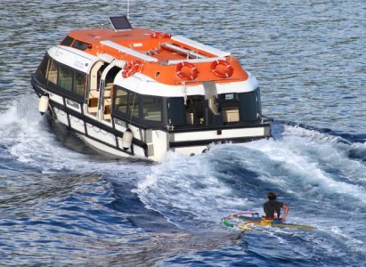OC paddler riding the boat-induced lumps (Photo: Doug McFarlane)