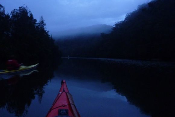 First light. Glassy water, layers of fog, and complete silence.