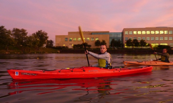 Paddlers setting off at sunset for a night cruise through Chi-Town