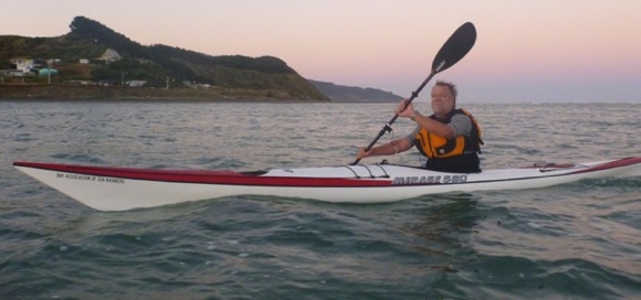 KASK paddler and event organiser John Hesseling playing at dawn on Raglan Harbour