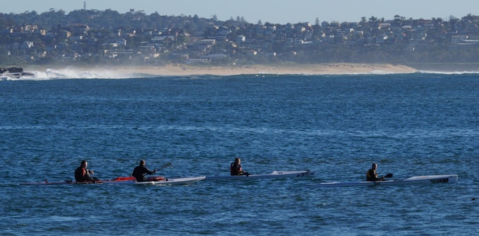 The Team Fat Paddler surfski crew paddling off Manly on a beautiful Autumn day