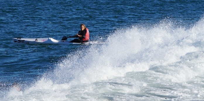 Tanya about to charge a lumpy wave