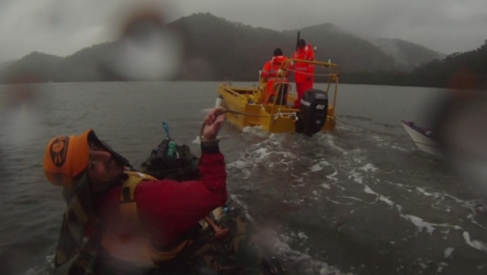 The end of 2010, a final tow to shore after 93km of paddling through the storm