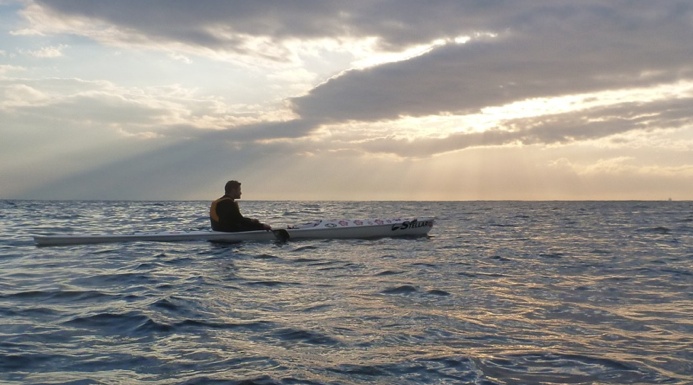 Nat awaiting the Manly sunrise from a Stellar SR surfski