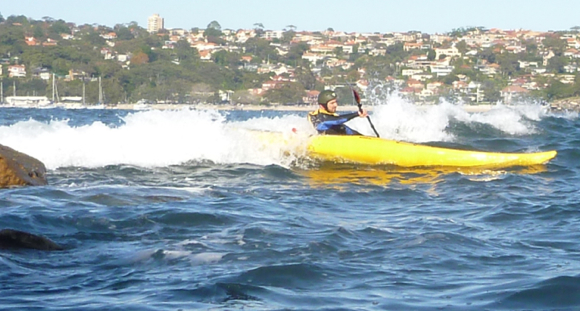 Lt. Gelo catches his first ever wave in a kayak. Nice!